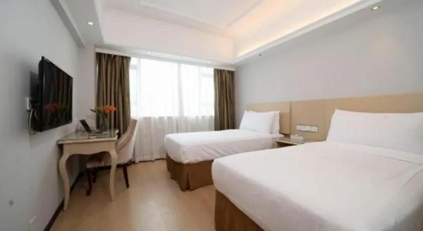 Bed in Vienna Hotel Shenzhen Pinghu Shuangyong Street Metro Station