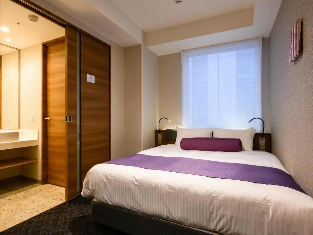 Bed in KEIKYU EX INN Haneda Innovation City 2 minutes walk from HICity Exit of Tenkubashi Station