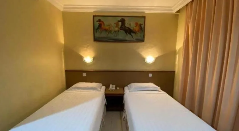 Bed in OYO 89958 Hotel Umimas