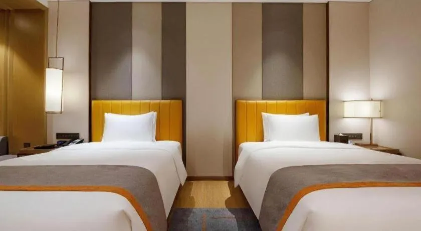 Bed in Hui Feng Wan Yun Hotel Hefei