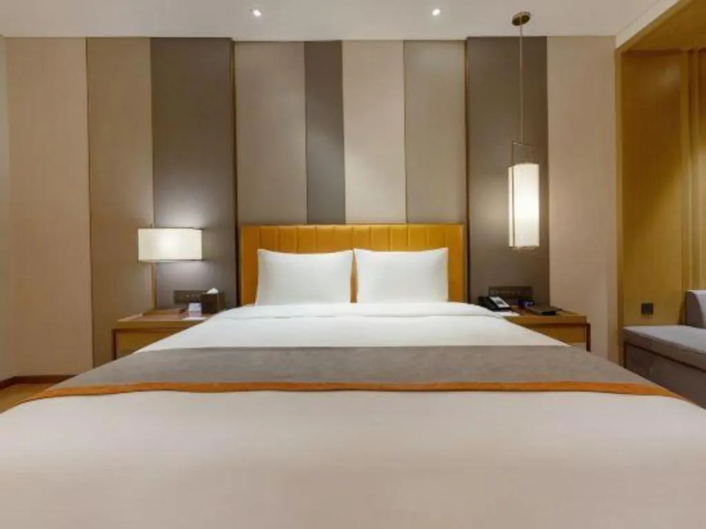 Bed in Hui Feng Wan Yun Hotel Hefei