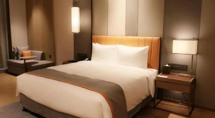 Bed in Hui Feng Wan Yun Hotel Hefei