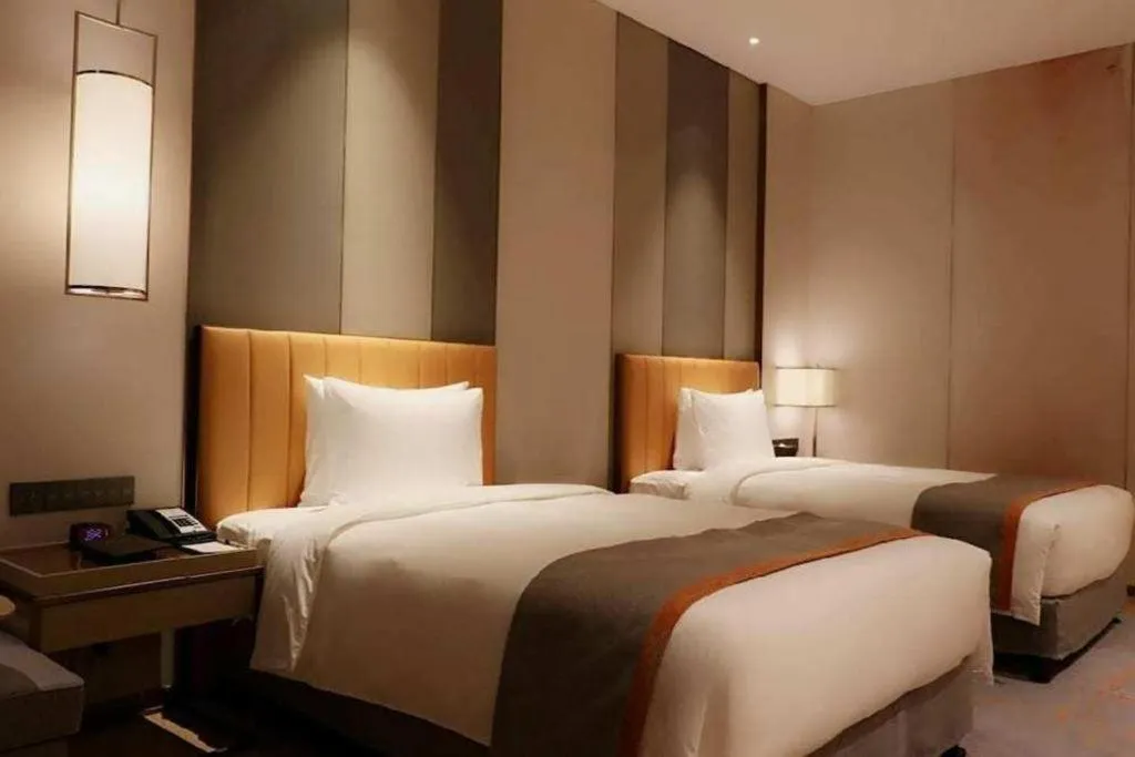 Bed in Hui Feng Wan Yun Hotel Hefei