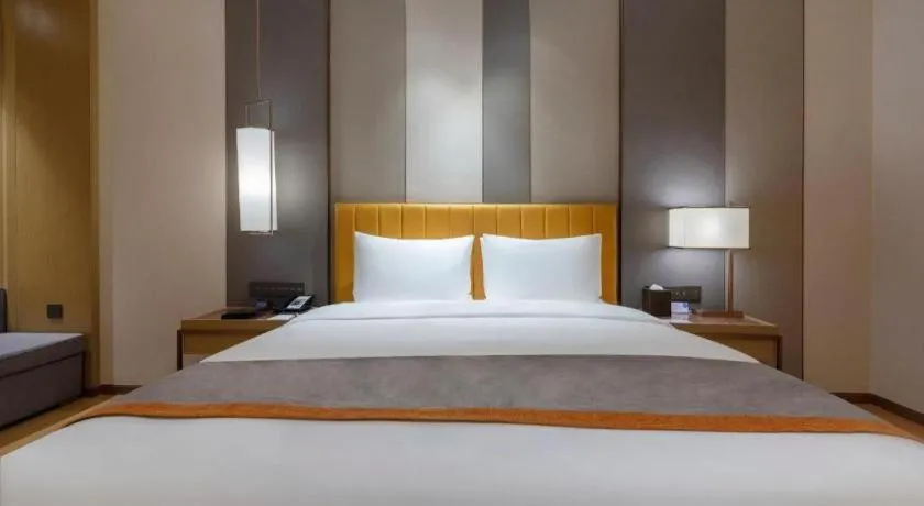Bed in Hui Feng Wan Yun Hotel Hefei