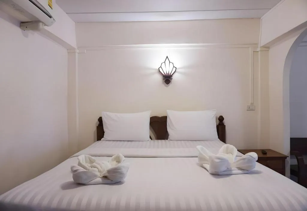 Bed in Nan Lanna Hotel