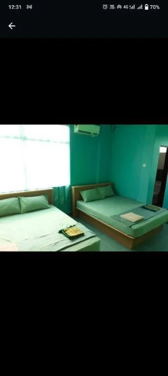 Bed in OYO 90471 Hotel Tepoh