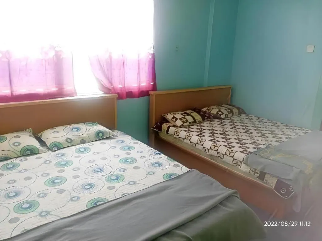 Bed in OYO 90471 Hotel Tepoh