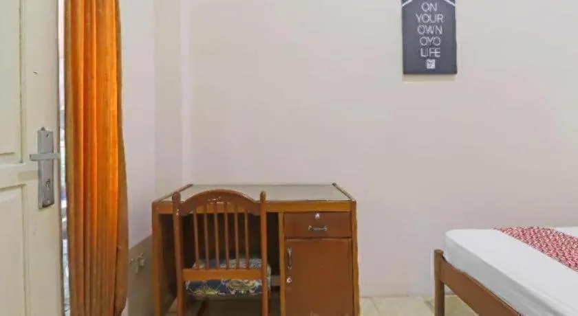 Bed in OYO 2899 Ardilia Bandara Syariah
