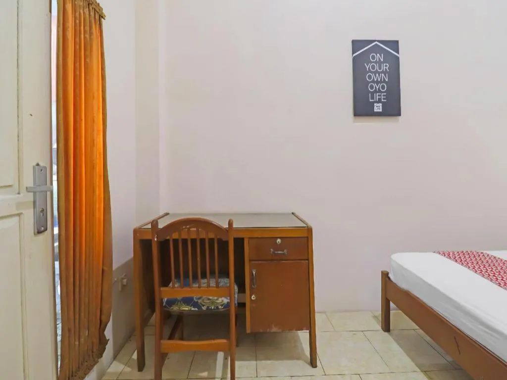 Bed in OYO 2899 Ardilia Bandara Syariah