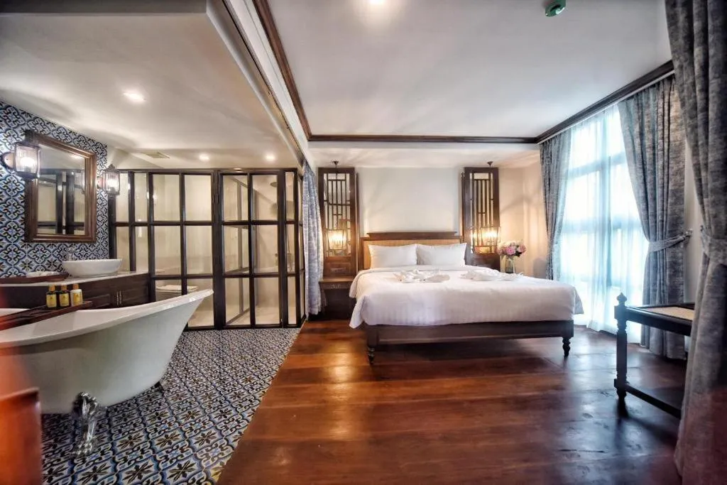 Bed in De Manor Chiang Mai Hotel