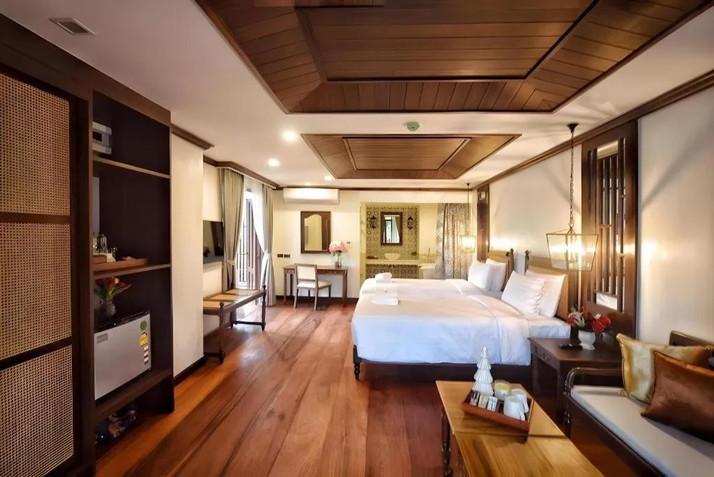 Bed in De Manor Chiang Mai Hotel