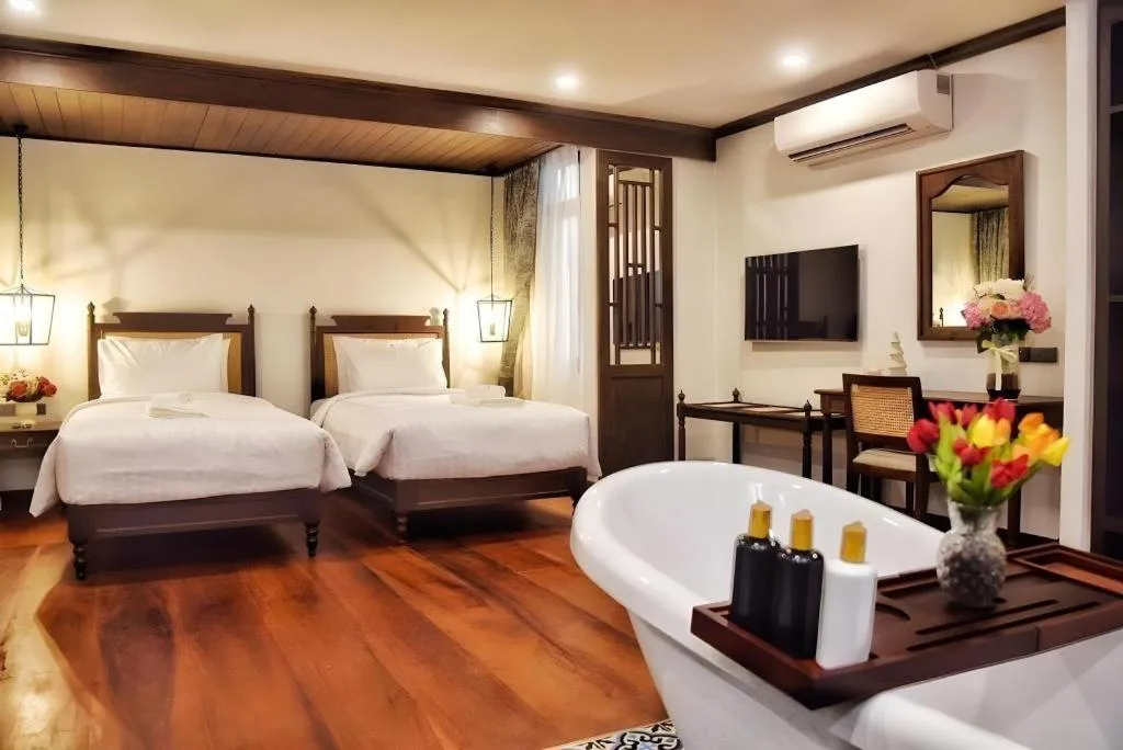 Bed in De Manor Chiang Mai Hotel