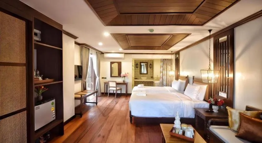 Bed in De Manor Chiang Mai Hotel