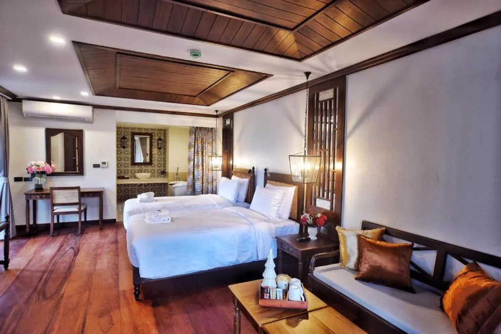 Bed in De Manor Chiang Mai Hotel