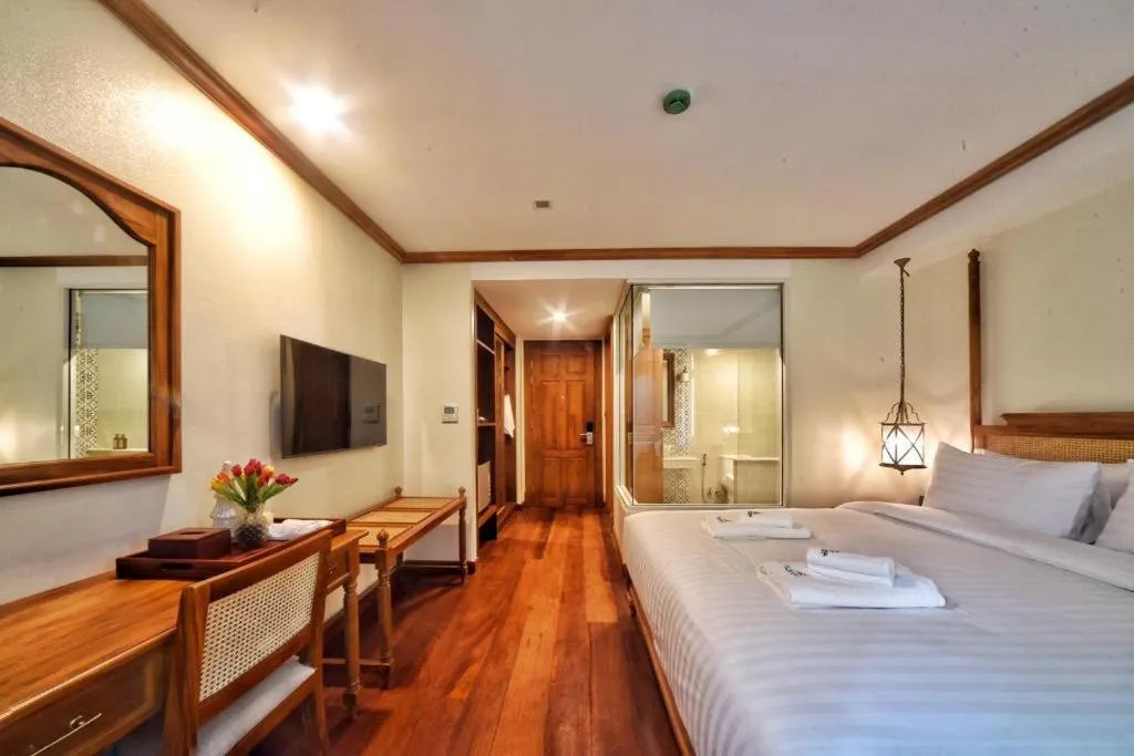 Bed in De Manor Chiang Mai Hotel