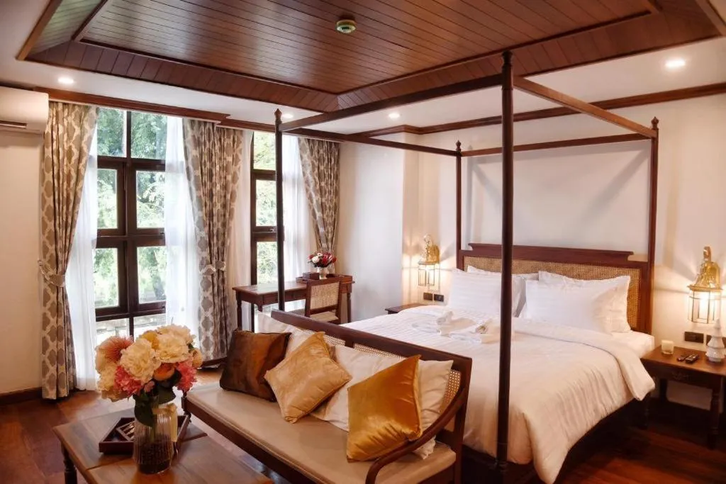 Bed in De Manor Chiang Mai Hotel