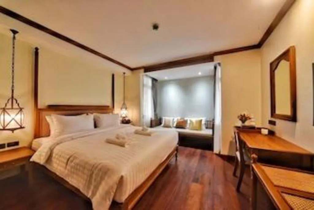 Bed in De Manor Chiang Mai Hotel