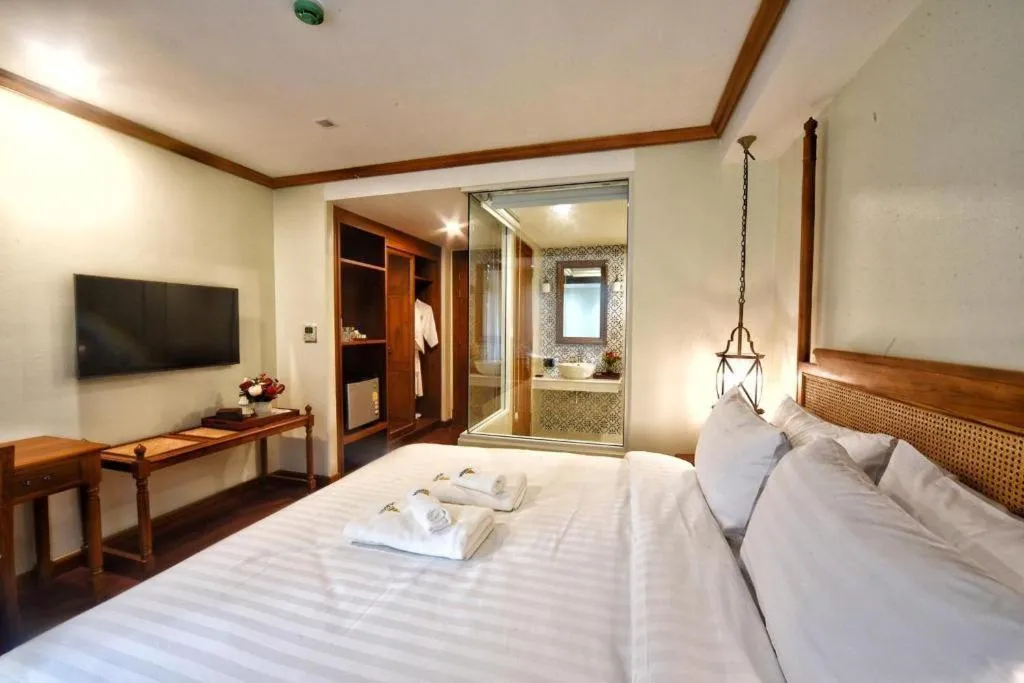 Bed in De Manor Chiang Mai Hotel