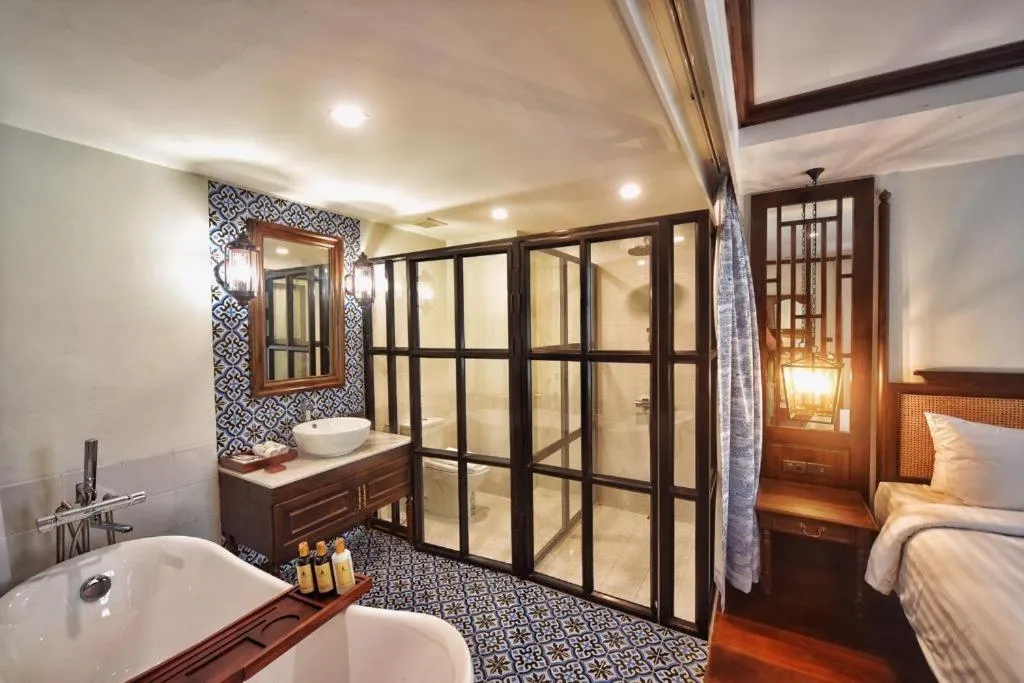 Bed in De Manor Chiang Mai Hotel