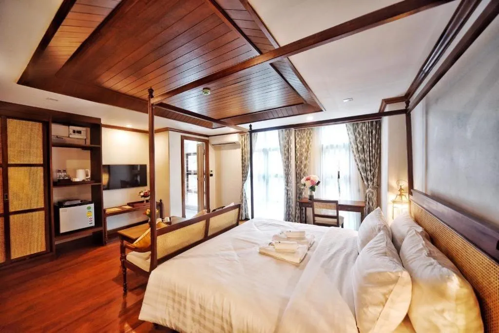 Bed in De Manor Chiang Mai Hotel