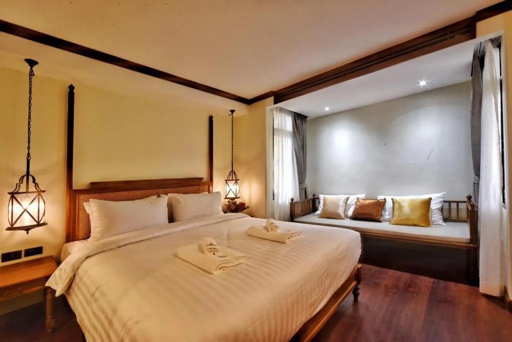 Bed in De Manor Chiang Mai Hotel
