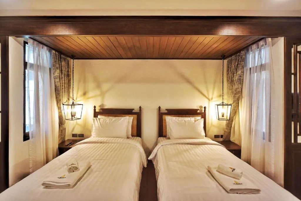 Bed in De Manor Chiang Mai Hotel