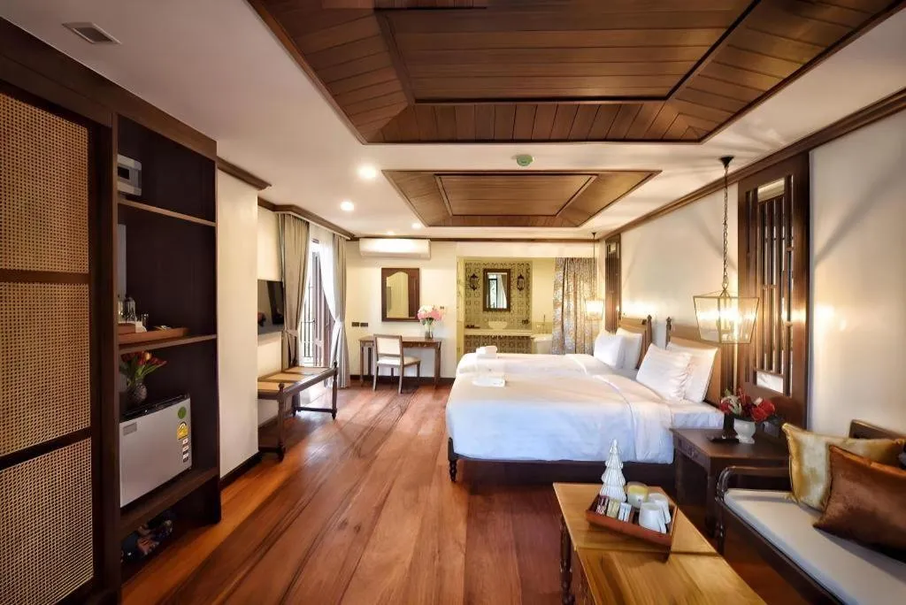 Bed in De Manor Chiang Mai Hotel