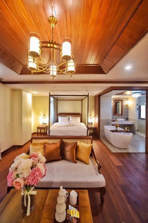 Bed in De Manor Chiang Mai Hotel