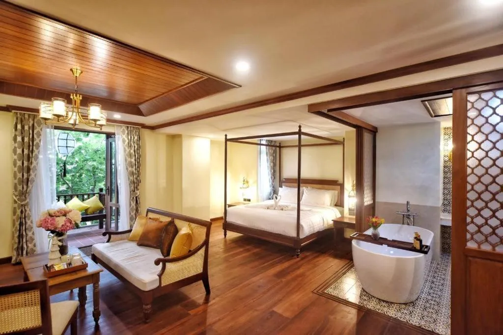 Bed in De Manor Chiang Mai Hotel