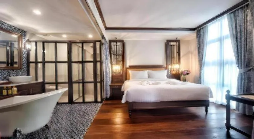 Bed in De Manor Chiang Mai Hotel