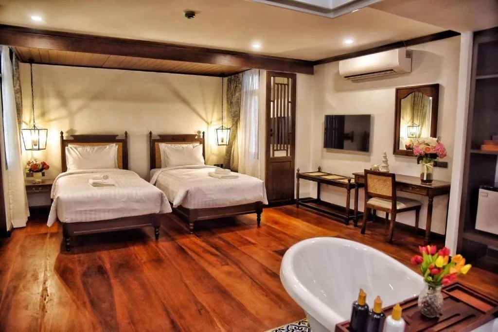 Bed in De Manor Chiang Mai Hotel