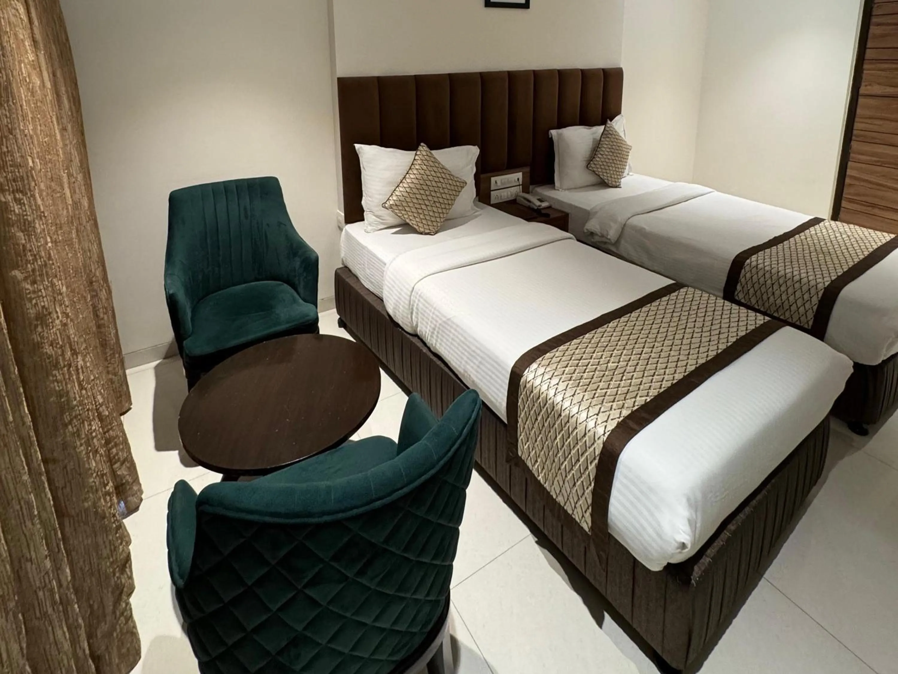 Bed in Hotel Pacific Residency