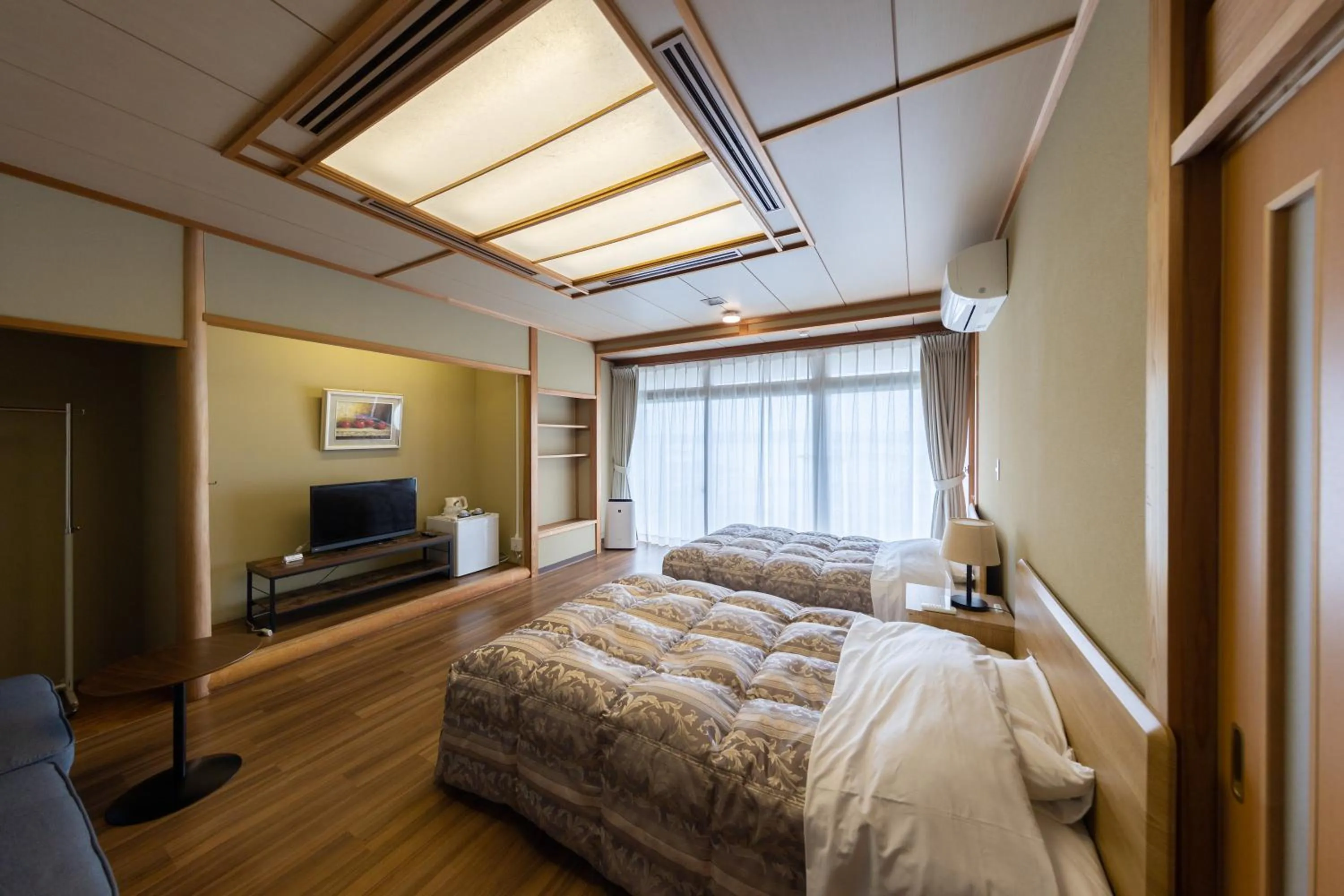 Bed in GARDEN HOTEL Hanayo