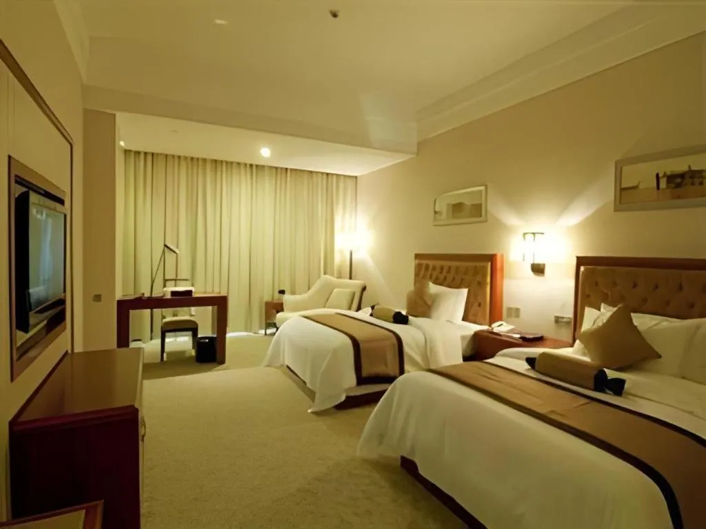 Bed in Yihao International Hotel