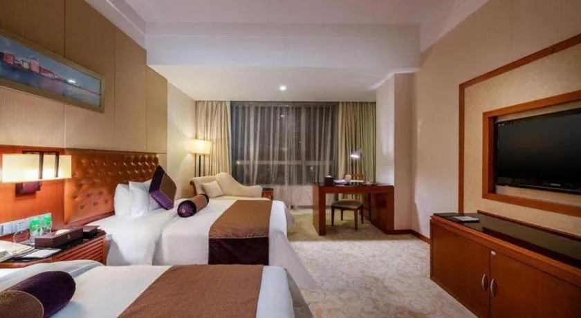 Bed in Yihao International Hotel