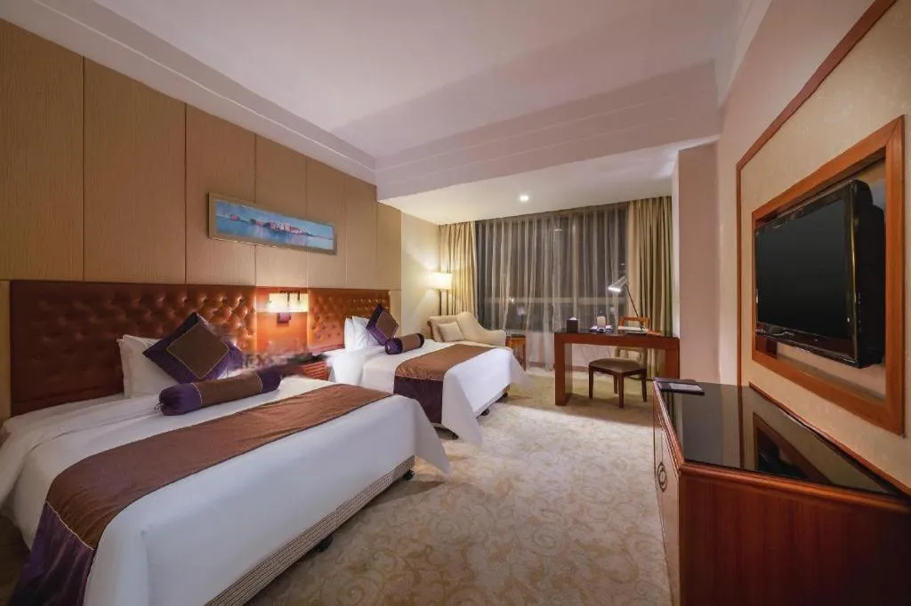 Bed in Yihao International Hotel