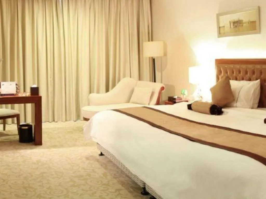 Bed in Yihao International Hotel