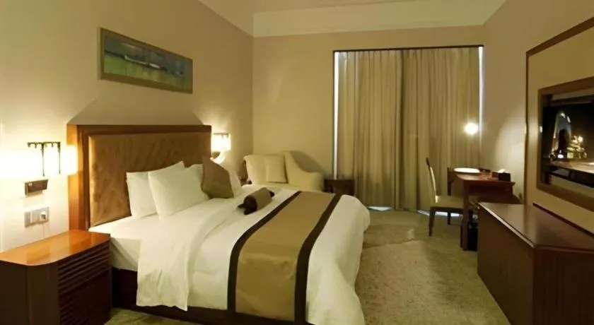 Bed in Yihao International Hotel