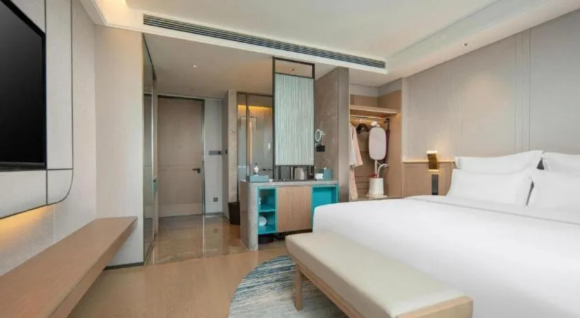 Bed in Chutian Guangdong International Hotel