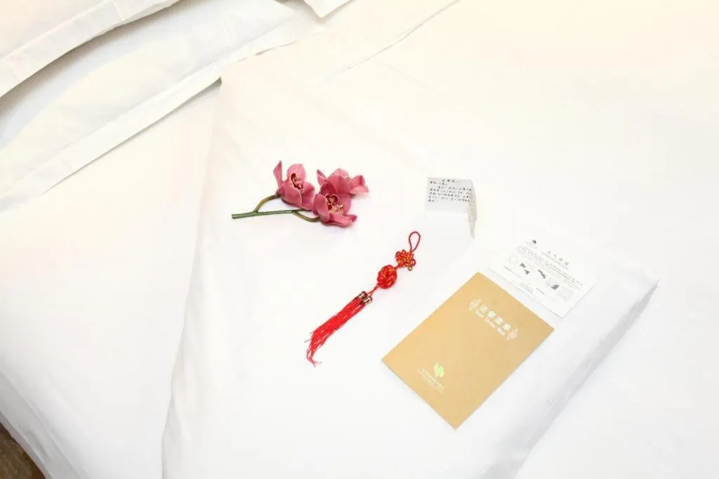 Bed in Chutian Guangdong International Hotel