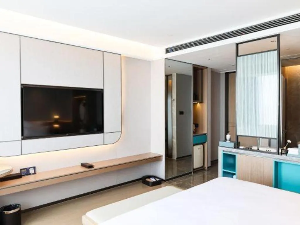 Bed in Chutian Guangdong International Hotel