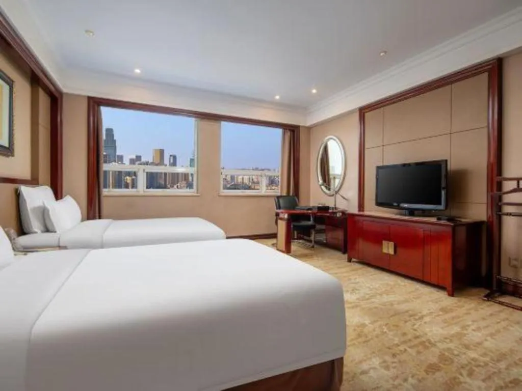 Bed in Chutian Guangdong International Hotel