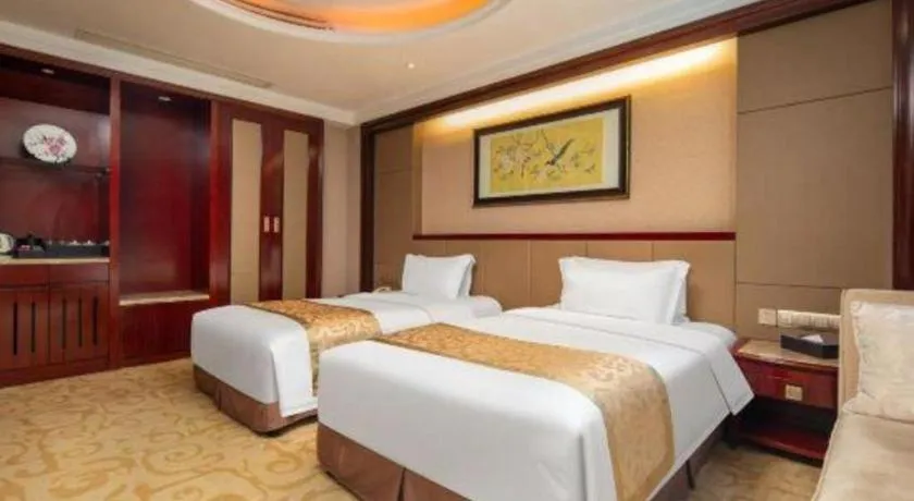 Bed in Chutian Guangdong International Hotel