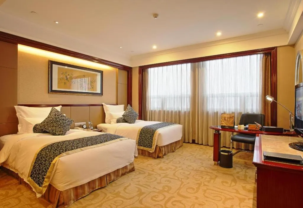 Bed in Chutian Guangdong International Hotel
