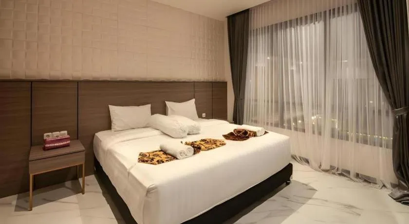 Bed in Sumbawa Grand Hotel