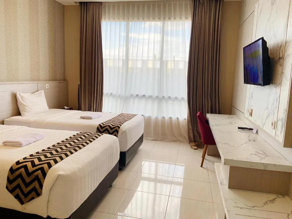 Bed in Sumbawa Grand Hotel