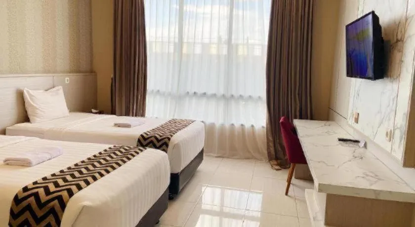 Bed in Sumbawa Grand Hotel