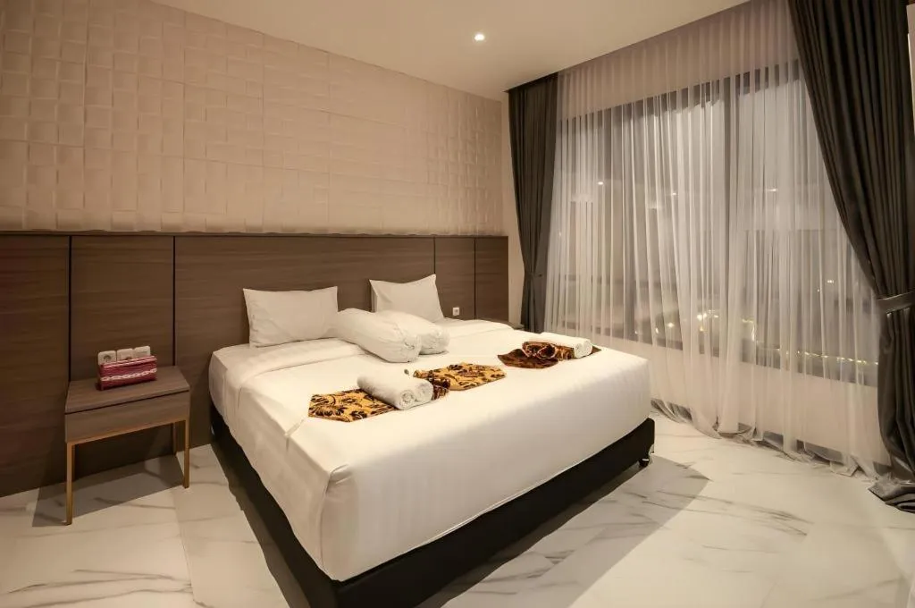 Bed in Sumbawa Grand Hotel