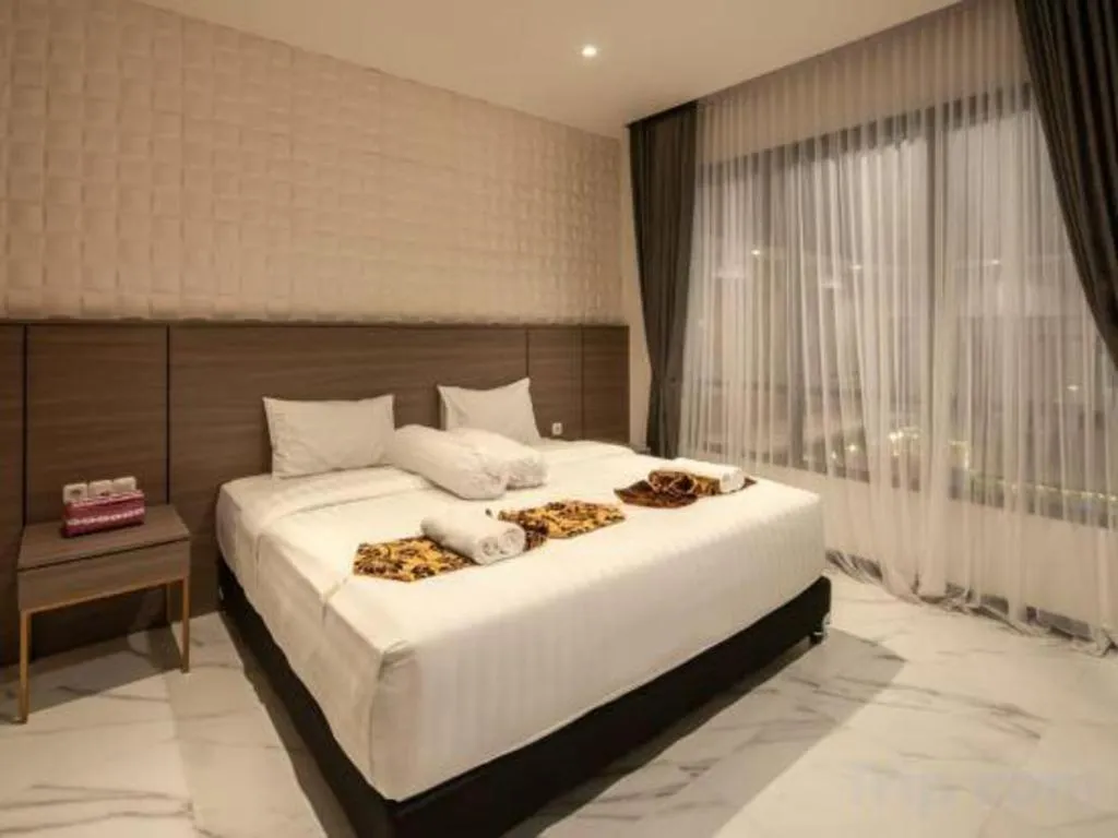 Bed in Sumbawa Grand Hotel