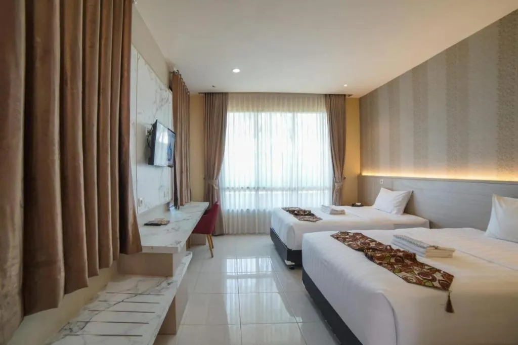 Bed in Sumbawa Grand Hotel